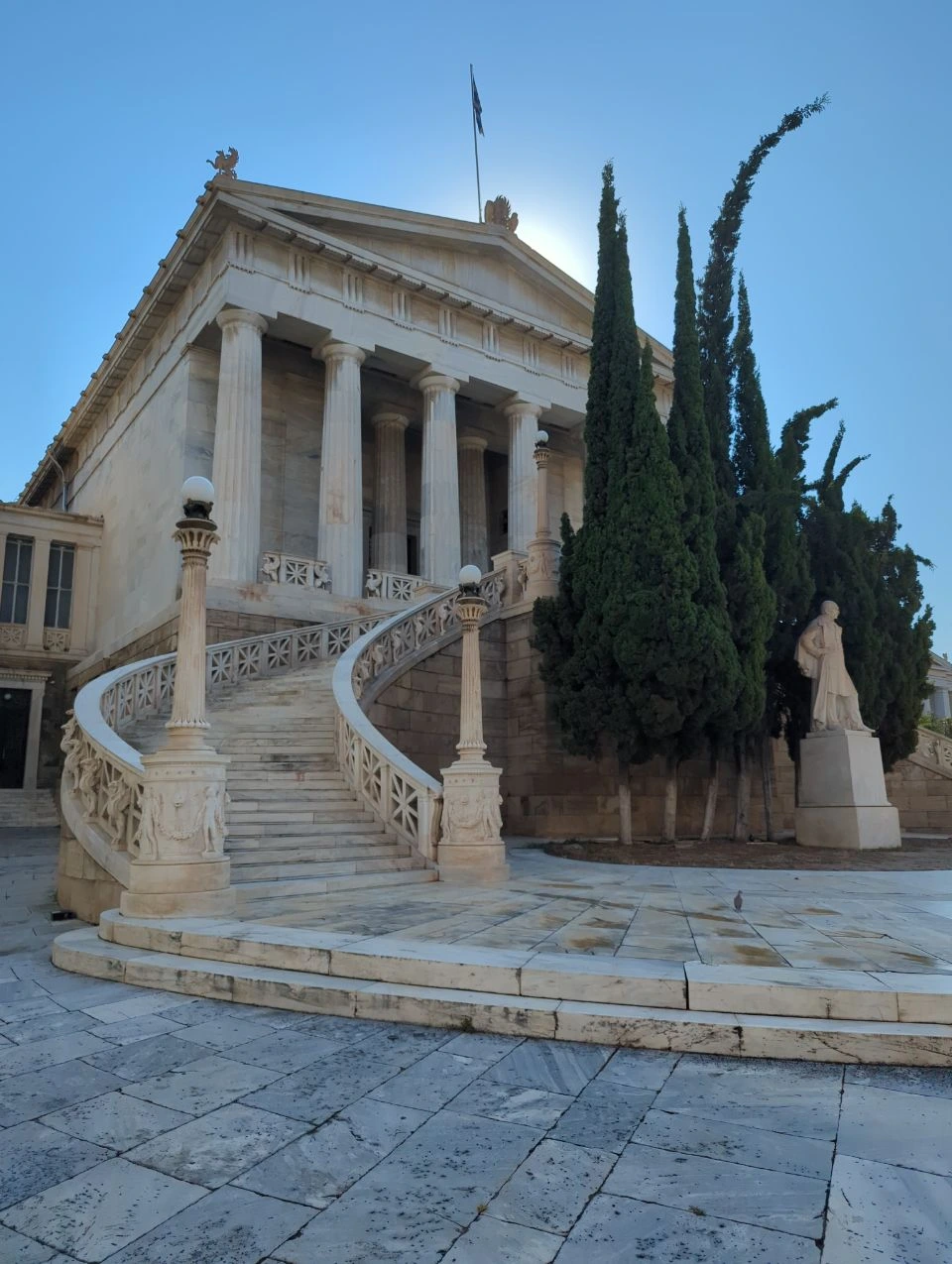 Old National Library Marble Staircase The Old National Library in Athens, with its curved marble staircase, classical columns and tall cypress trees.