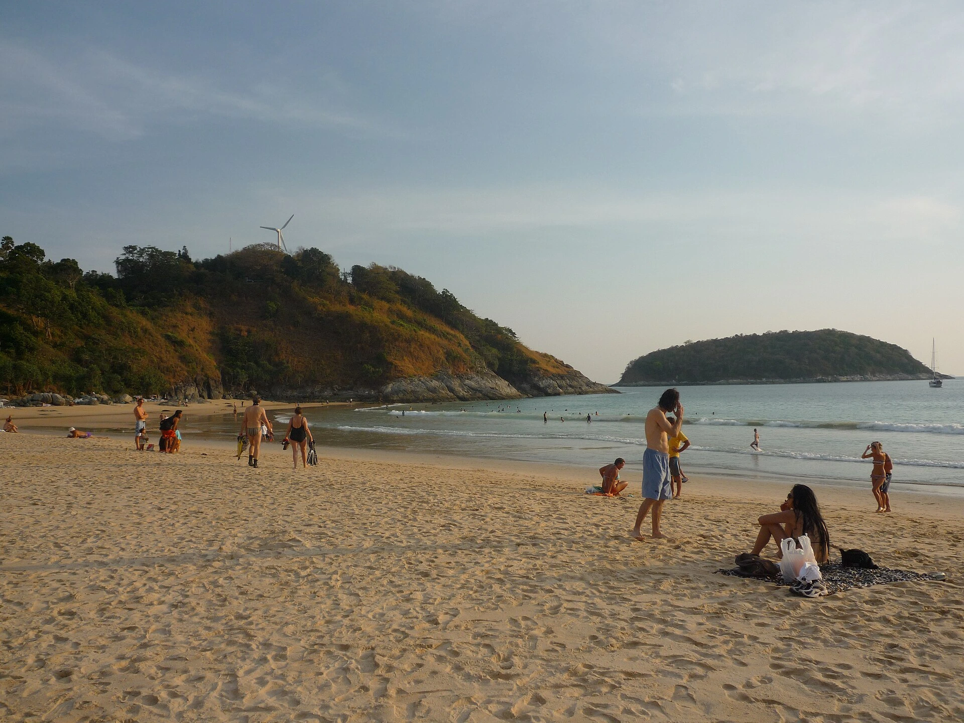 Families and holidaymakers enjoying a sandy beach in Phuket
