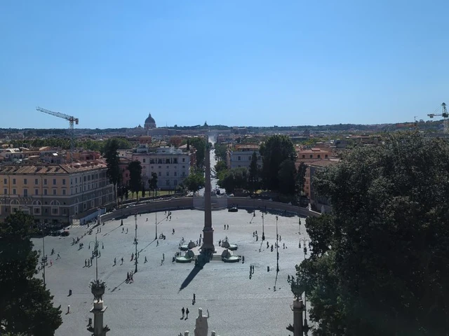 Rome Photoshoot Duration - Pincio Viewpoint Piazza del Popolo, its central obelisk and Rome's rooftops spread below the elevated Pincio terrace in clear daylight.