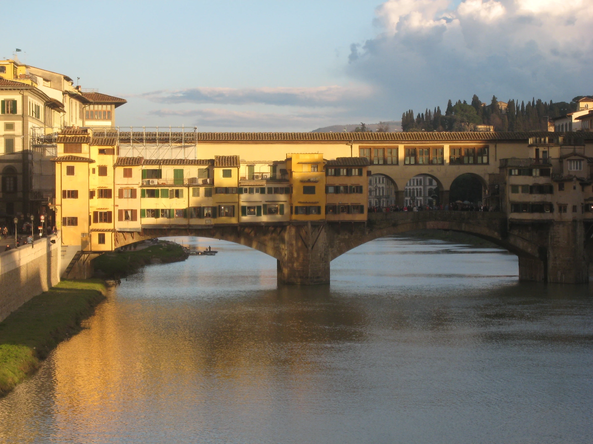 Ponte Vecchio and its riverside arches seen from Ponte Santa Trinita in Florence