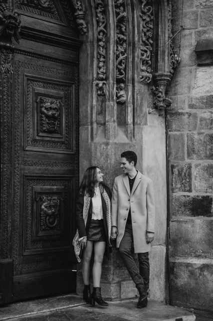 An Old Town doorway in black and white Black and white portrait of the couple at a carved doorway during their engagement photoshoot in Prague Old Town