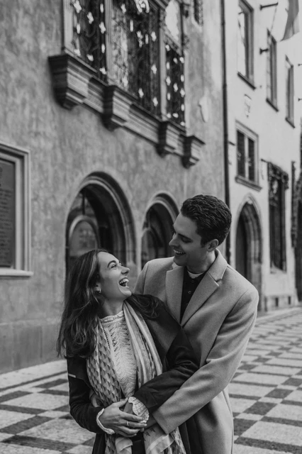 An Old Town embrace in black and white Black and white portrait of the couple embracing in Old Town during their Prague engagement photoshoot