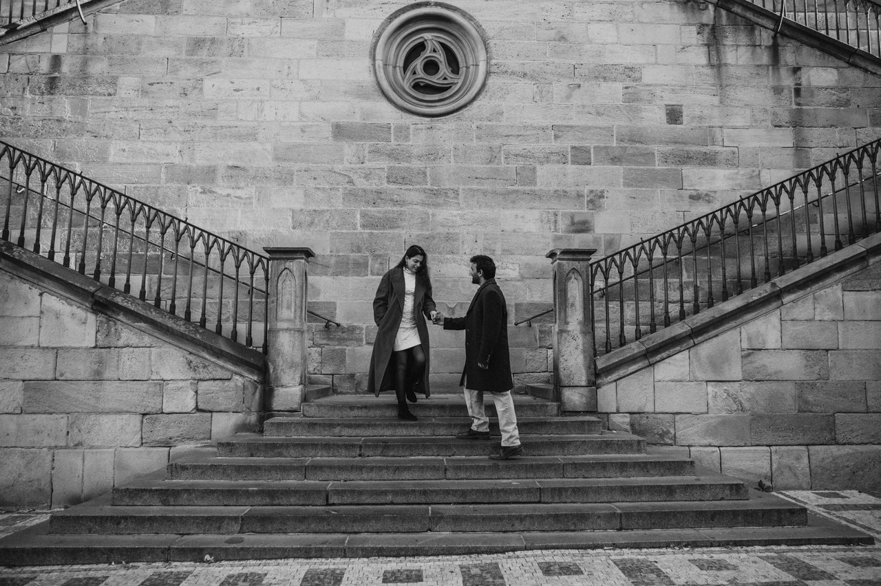 Prague couple photoshoot: black and white portrait on the broad Kampa stairs. Black and white portrait on the broad Kampa stairs during a couple photoshoot in Prague.