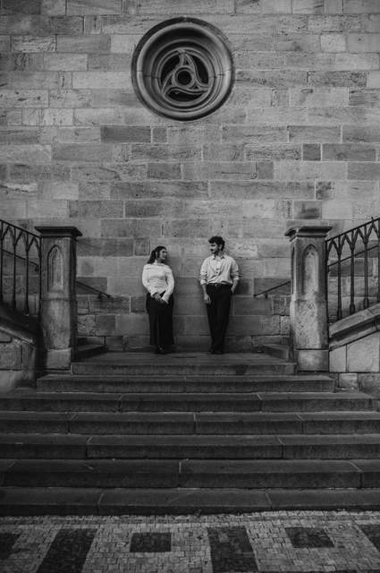 Prague couple photoshoot: black and white portrait on the broad Kampa staircase. Black and white portrait on the broad Kampa staircase during a couple photoshoot in Prague.