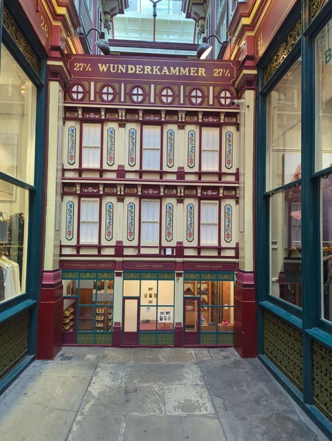 The burgundy, cream and gold miniature Wunderkammer frontage beneath Leadenhall Market’s roof in September 2026