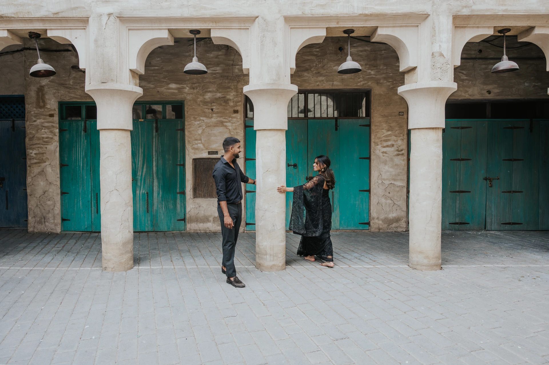 Couple at Al Fahidi old Dubai route planning engagement photoshoot