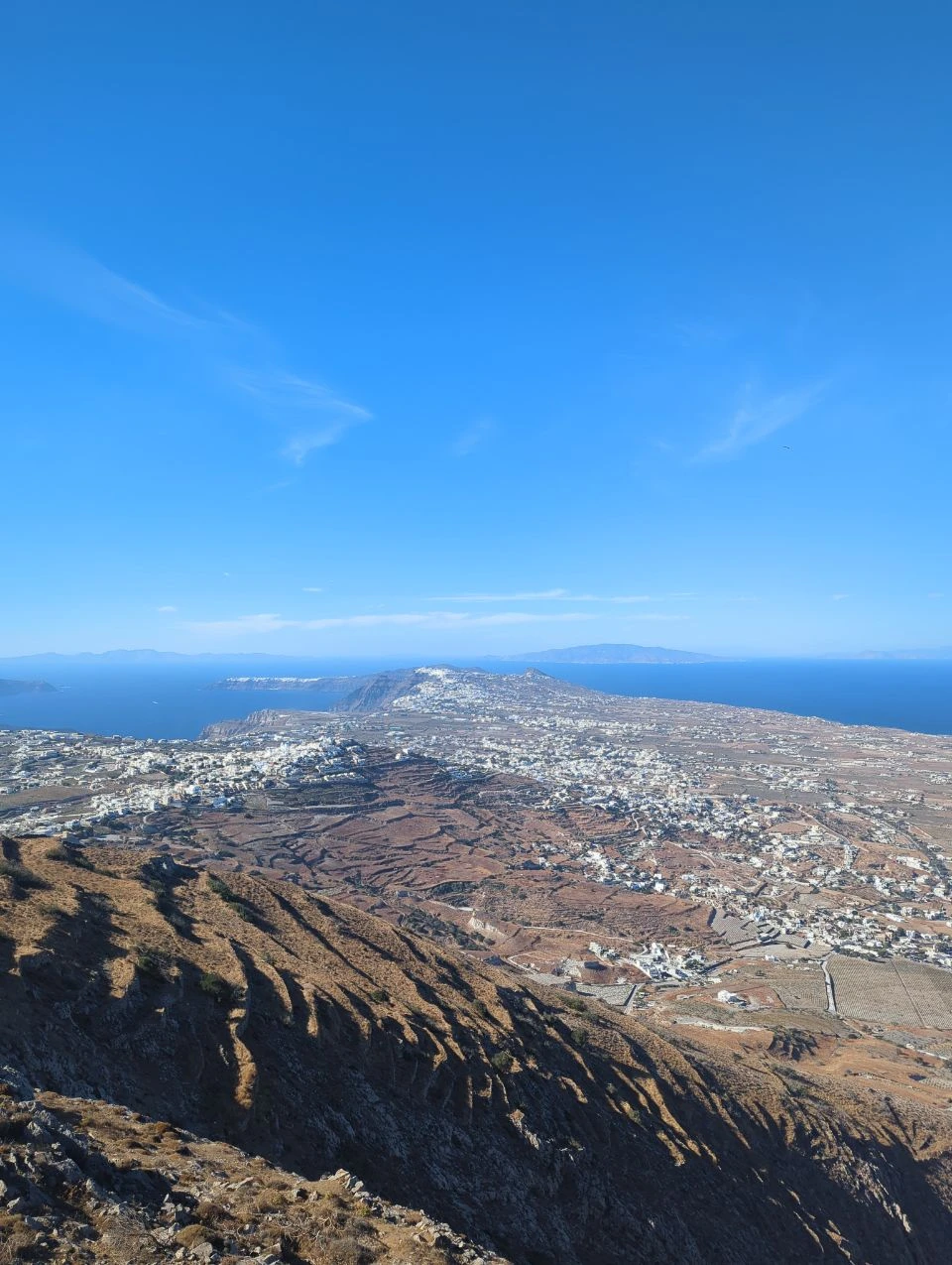 Santorini island panorama from Profitis Ilias area Broad view across Santorini's inland villages, caldera edge and sea from the high interior