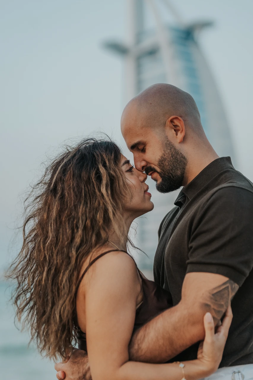 Proposal at Shimmers - intimate close couple portrait A couple shares an intimate close-up portrait after a proposal at Shimmers in Dubai, focusing on expressions and warm connection.