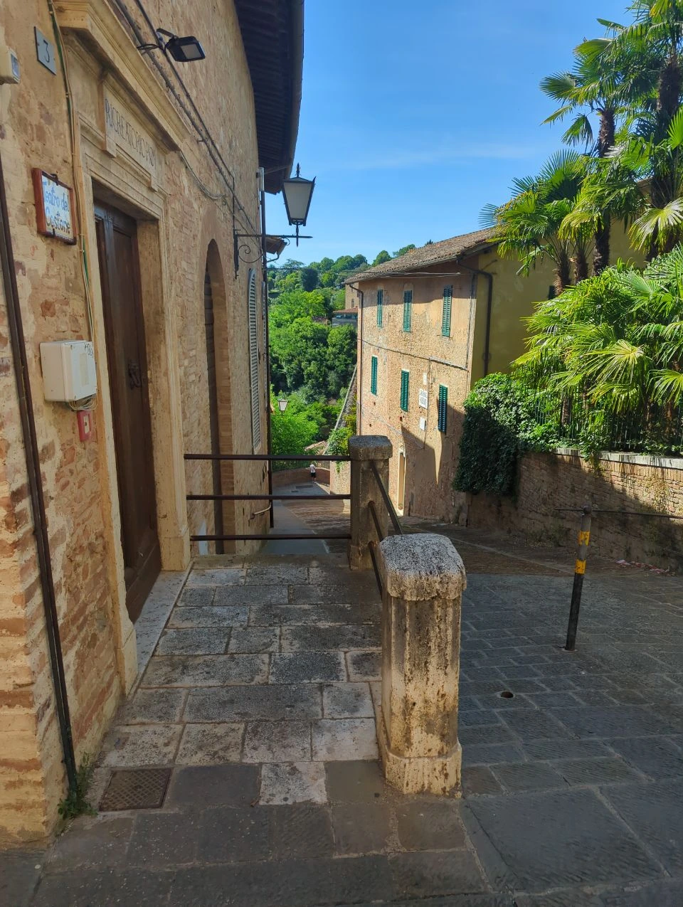 Siena photoshoot inspiration with old stone streets and green shutters