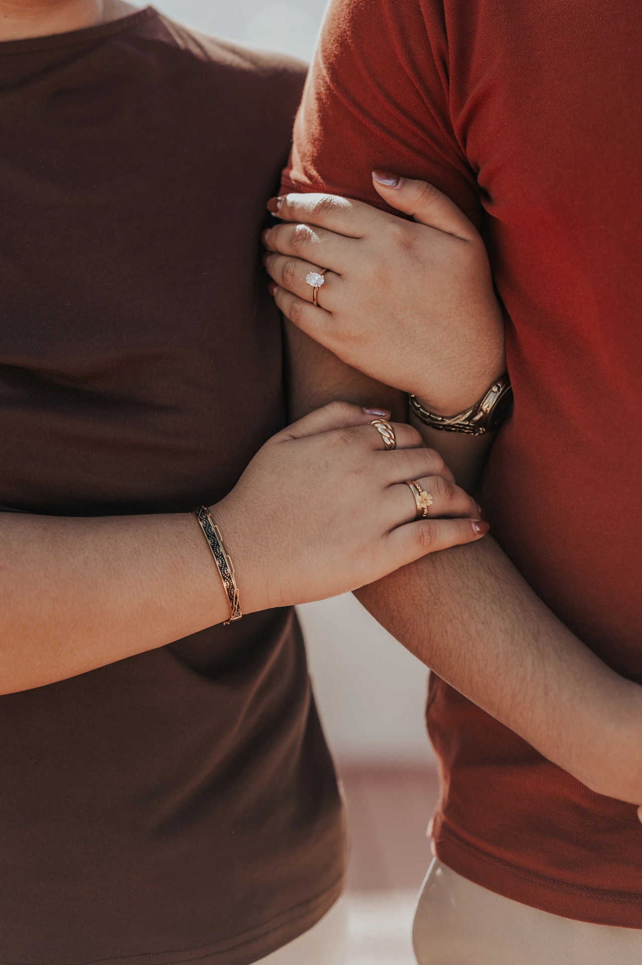 Dubai Yacht Proposal Ring Detail A woman’s engagement ring rests against her partner’s arm in a close-up from a Dubai proposal photographer session.