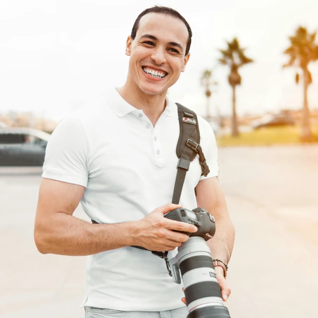 Choose your photographer Photo of photographer with his viewfinder as subject with a woman in view