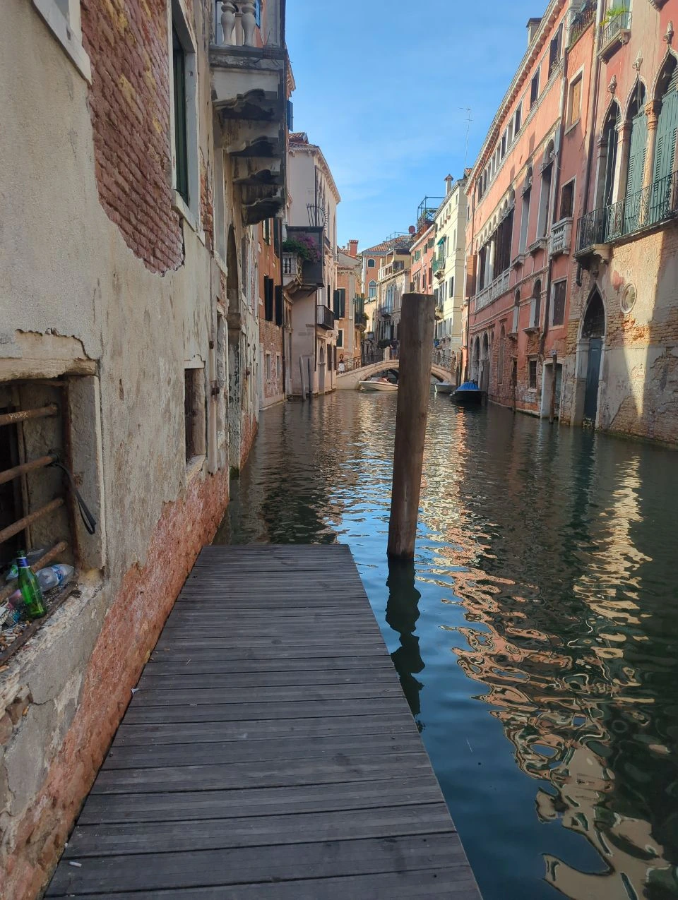 Wooden landing on a narrow Venice canal