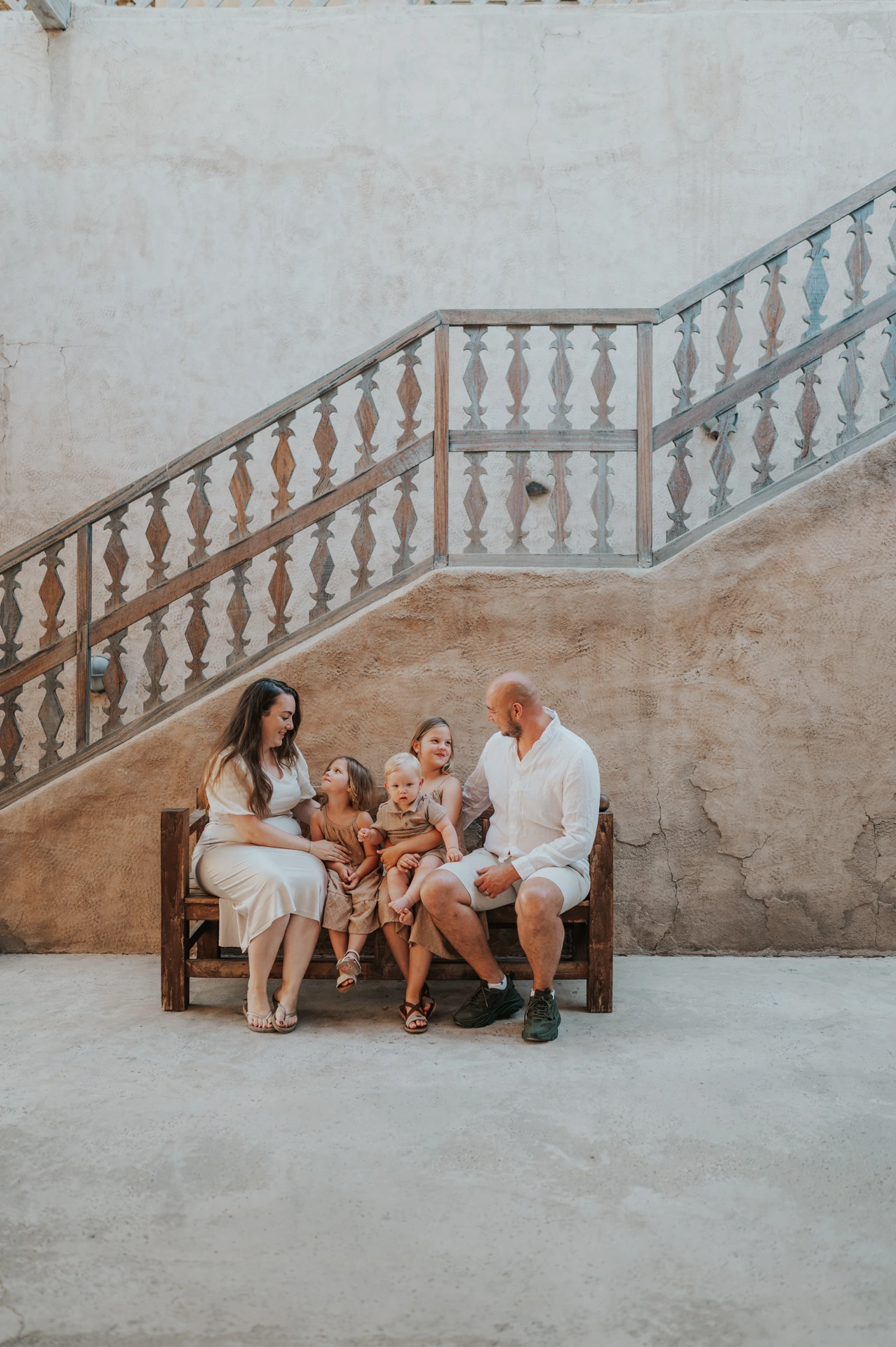 Family seated portrait in Old Dubai with everyone fully visible